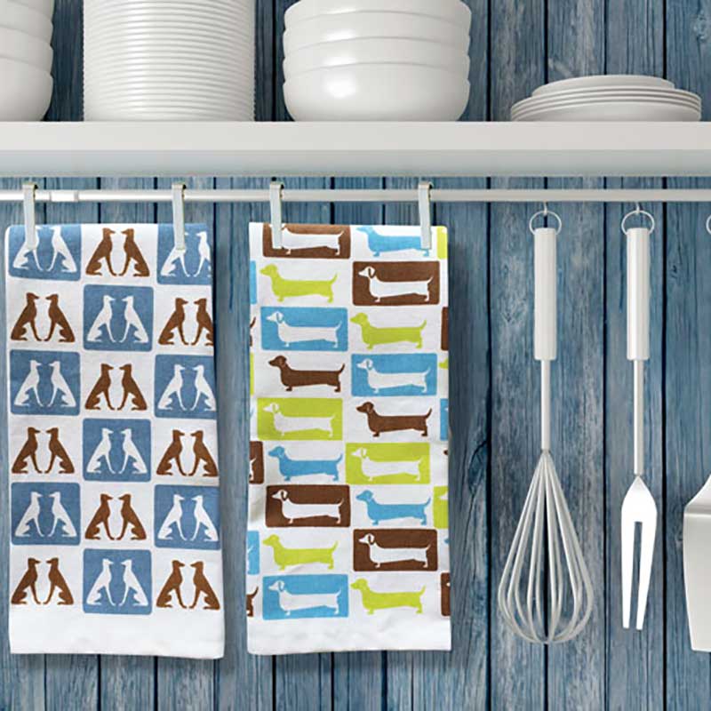 Image of Naked Decor tea towels hangin above kitchen sink.