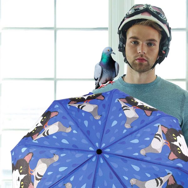 Model holding Pigeon and Tuxedo cat umbrella.